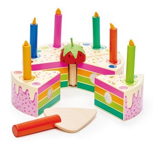 Image of a solid wood pretend play birthday cake made from rubberwood & painted in bright rainbow colours, topped with 6 coloured candles.
