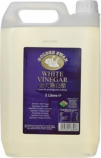 Image of a bottle of white vinegar to help you make your own cleaning products and switch to eco friendly