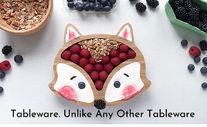 Image of a child's bamboo food plate in the shape of a fox, to bring a little fun to mealtimes. Made from natural bamboo, the plate has suction to help it stay put.