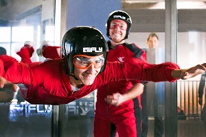 Image of a teenager trying an indoor skydiving experience.