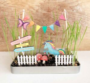 Image of a make-your-own magical unicorn garden gift for children. A creative and imaginative magical garden scene with wheatgrass seeds.