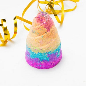 Image of a colourful 'unicorn poop' shaped bath bomb. This will make bath time loads of fun, whist being eco-conscious.