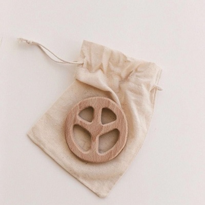 Image of the Fresh Thinking Co Natural Peace Sign Baby Teether, made with sustainable beech wood and finished smooth with no treating, coating or polishing, making it a great natural product.