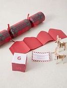 Image of Marks and Spencers 100% plastic free crackers and accompanying build-a-reindeer game